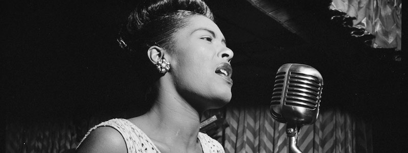 photo of Billie Holiday with a microphone