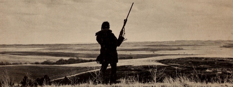 photo of an AIM militant ovelooking the Black Hills